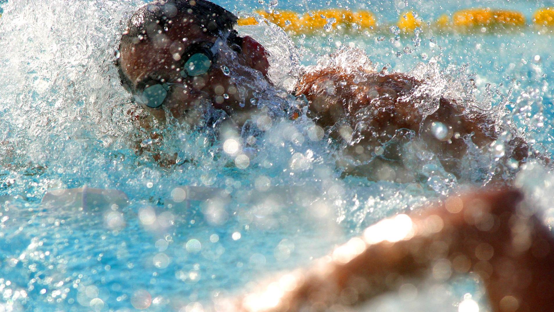 A man swimming in the pool