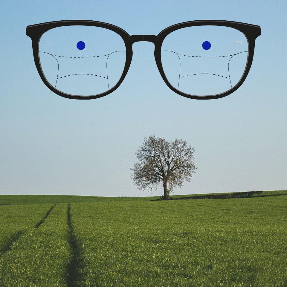 En båge med progressiva glas och schematiska linjer som indikerar olika synzoner. Olika delar av glaset är markerade: avstånd – den övre delen av glasögonen.