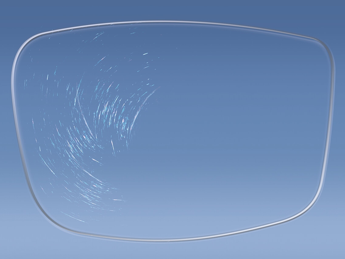 Illustrering av ett glasögonglas med och utan ZEISS-beläggningar som påverkar ytans hårdhet 
